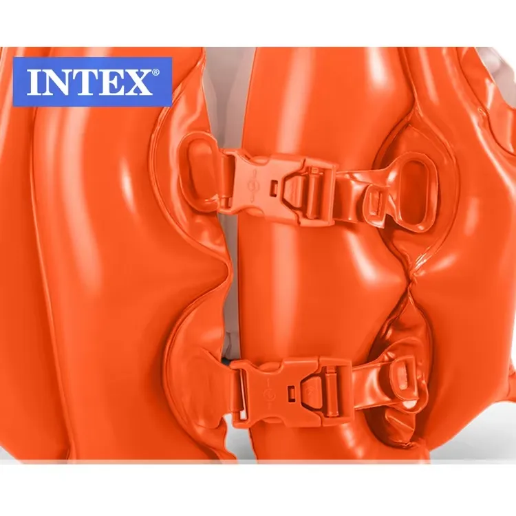 Close-up of two quick-release buckles on the orange Intex Deluxe Swim Vest