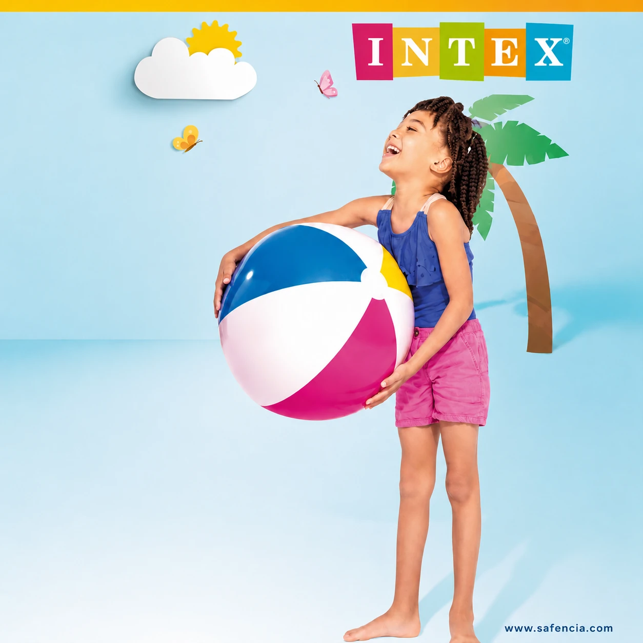 Child holding the large Intex Glossy Panel Ball, showing its size against a bright summer scene