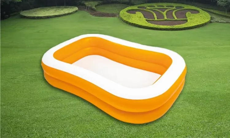 Intex Mandarin Swim Center Pool set up empty on a green lawn ready for family water play