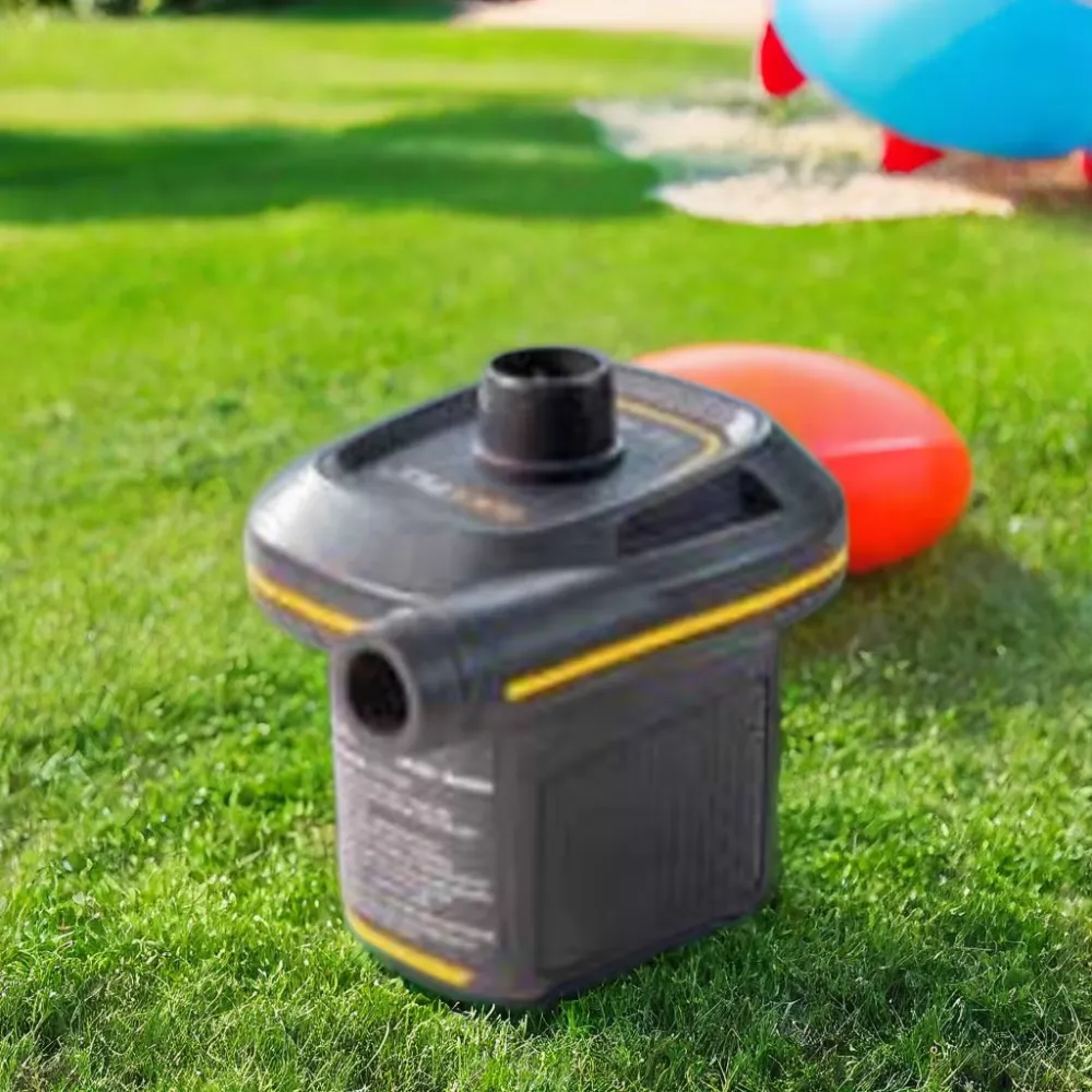 Intex Quick Fill USB Air Pump outdoors on grass beside inflatable pool items