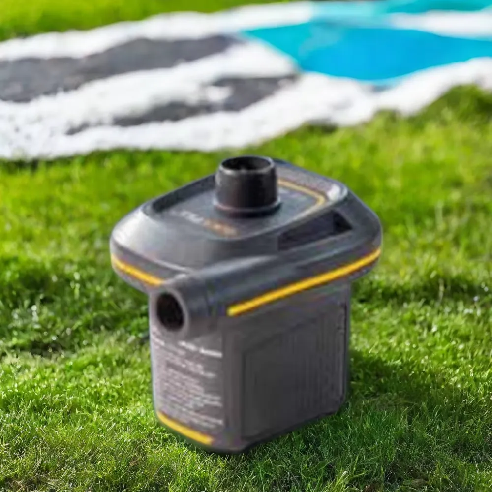 Intex Quick Fill USB Air Pump shown on grass during an outdoor pool setup
