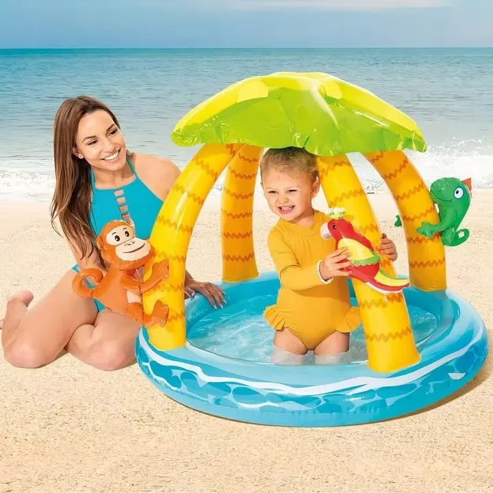 Intex Tropical Island Baby Pool on a beach with a mother and toddler playing under the palm shade
