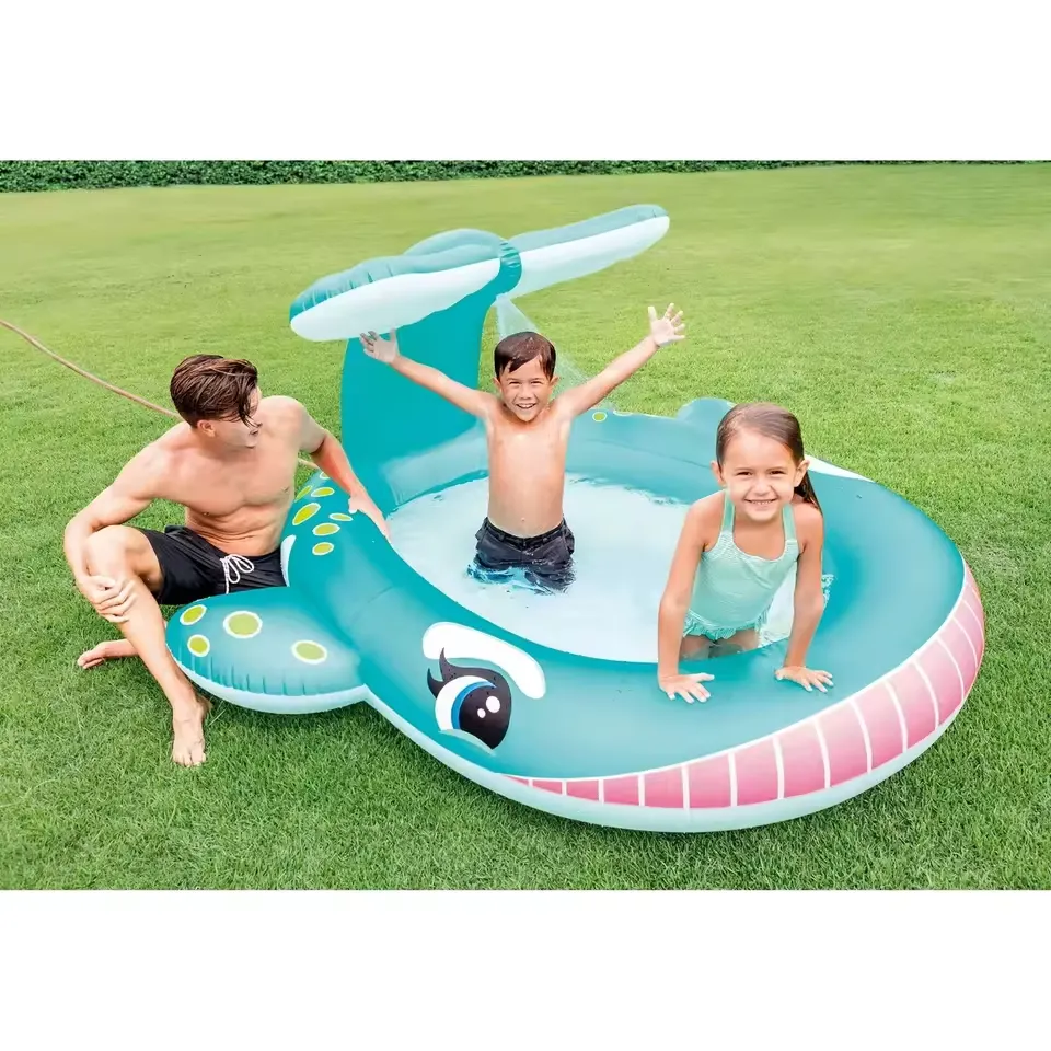 Intex Whale Spray Pool on grass with a father and two children enjoying the tail water spray