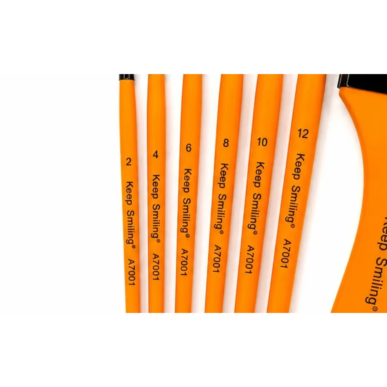 Close view of the Keep Smiling brush handles showing size stamps 2 to 12