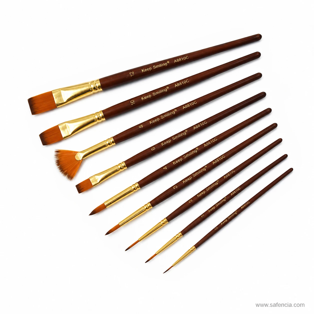 Close diagonal view of Keep Smiling brush heads and gold ferrules