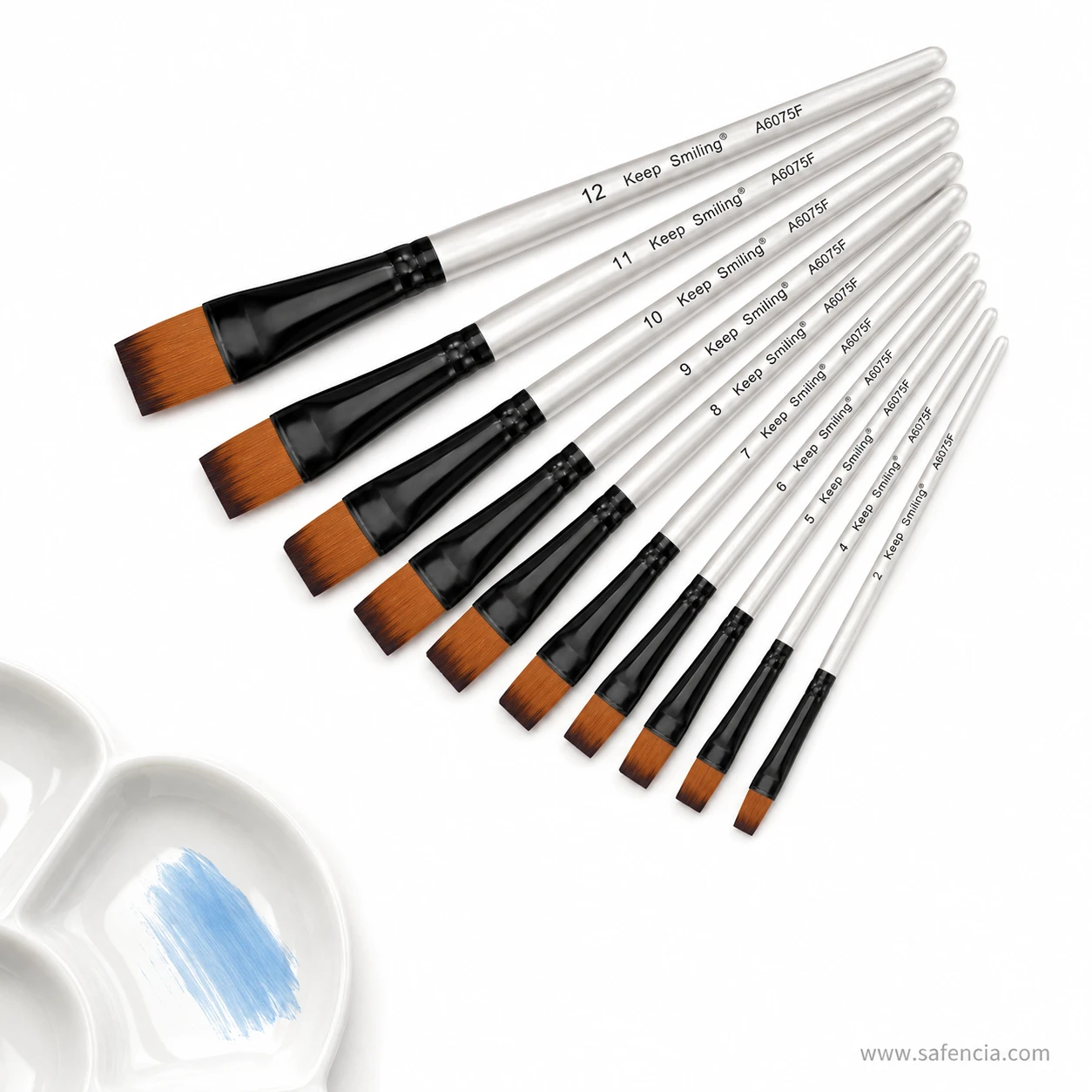 Keep Smiling flat brush set of 12 shown near a paint palette