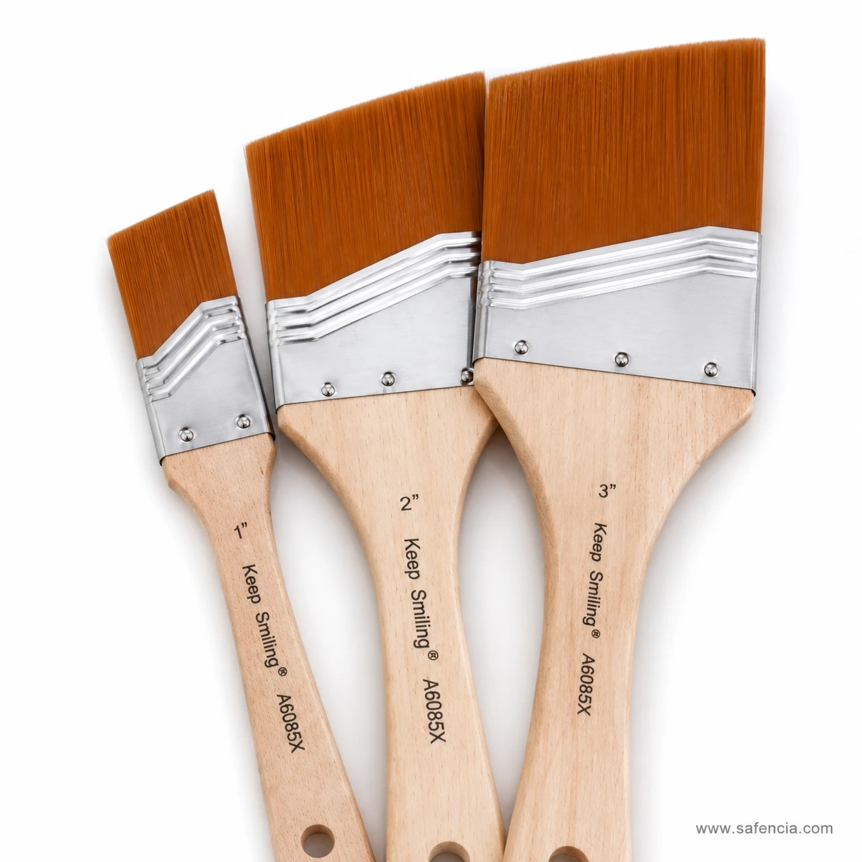 Close view of the gesso brushes showing riveted ferrules and wooden handles