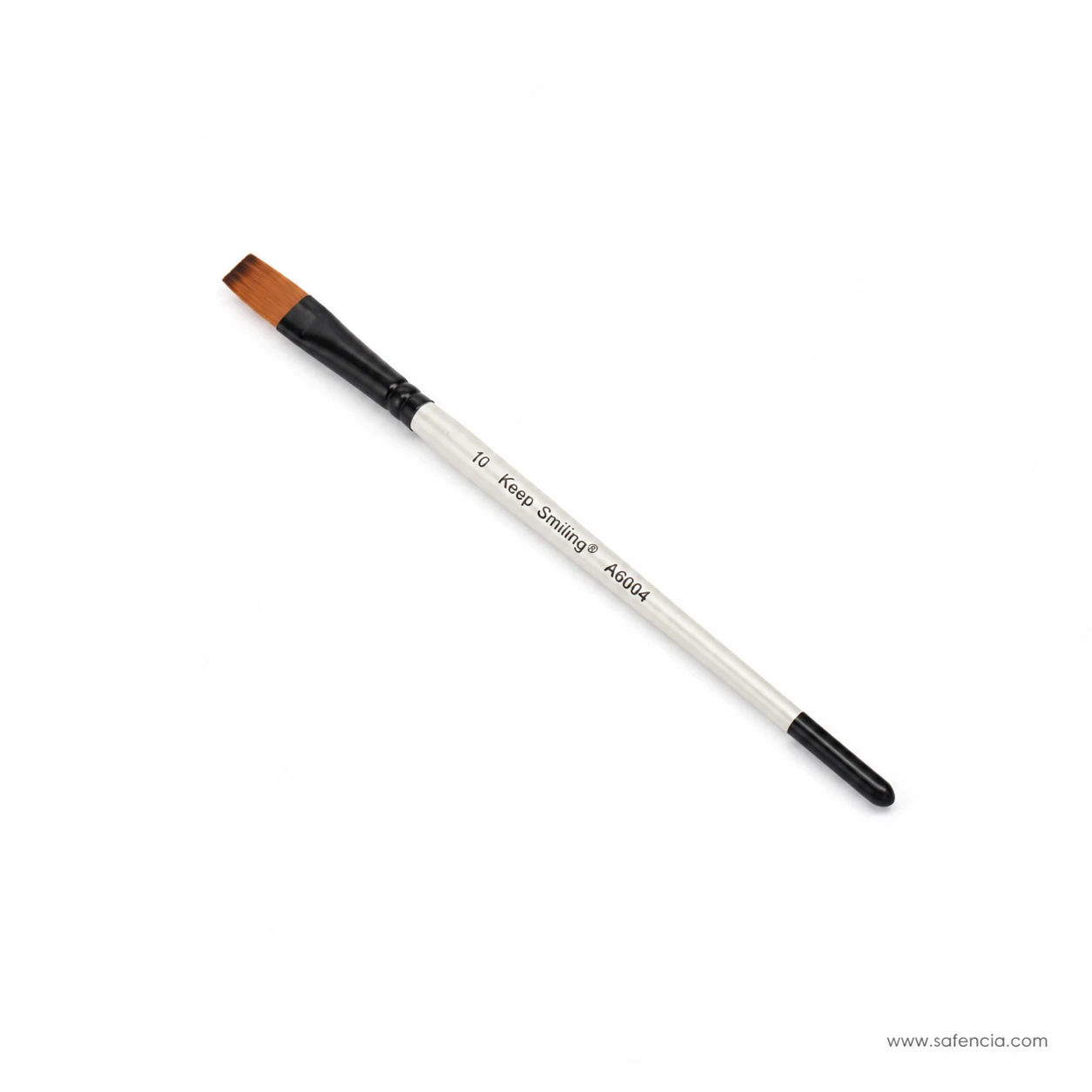 Keep Smiling flat paint brush photographed at an angle