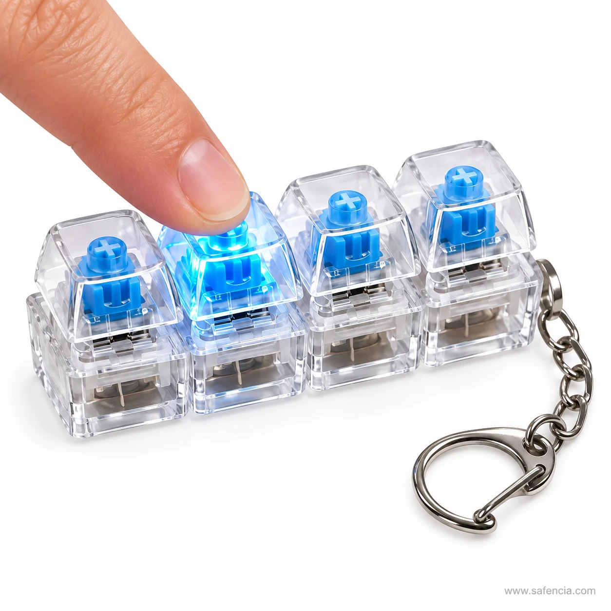 Fingertip pressing the second key of the keyboard clicker keychain so it glows bright blue