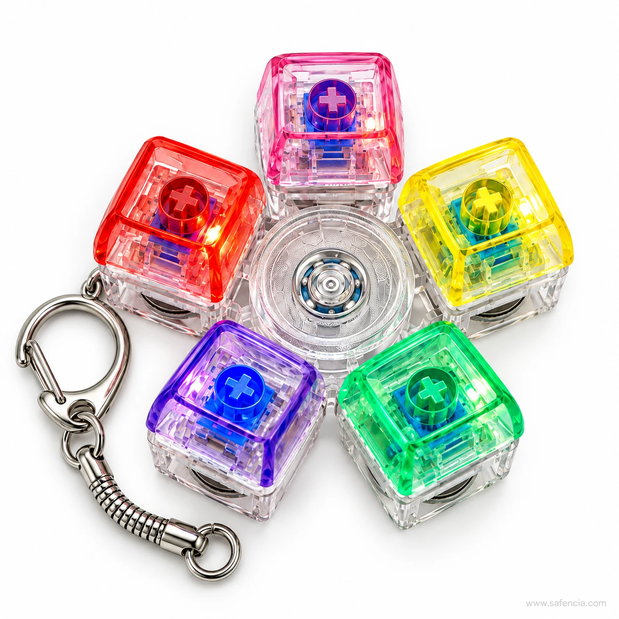 Top view of the five-key keyboard keychain fidget spinner showing the bearing in the clear centre