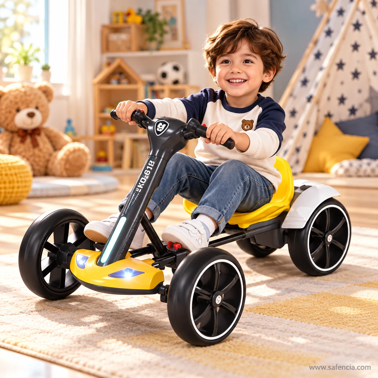 Smiling young boy sitting in the yellow kids electric drift kart and holding the steering handle