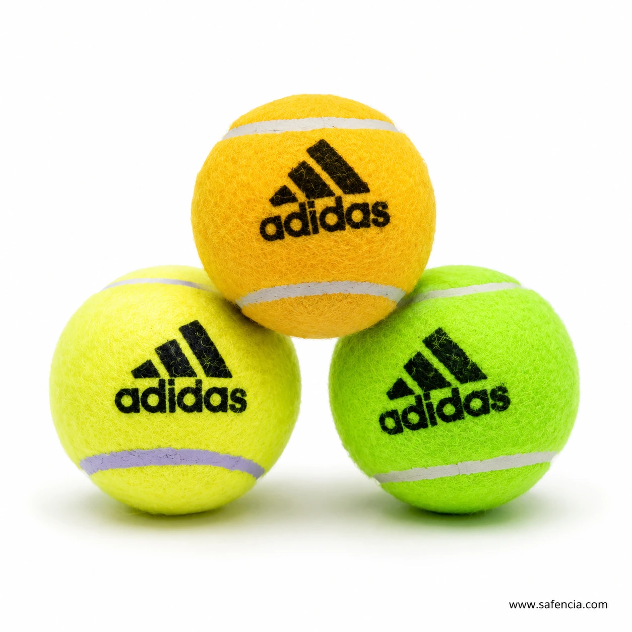 Kids tennis ball colour options arranged together showing yellow and green felt