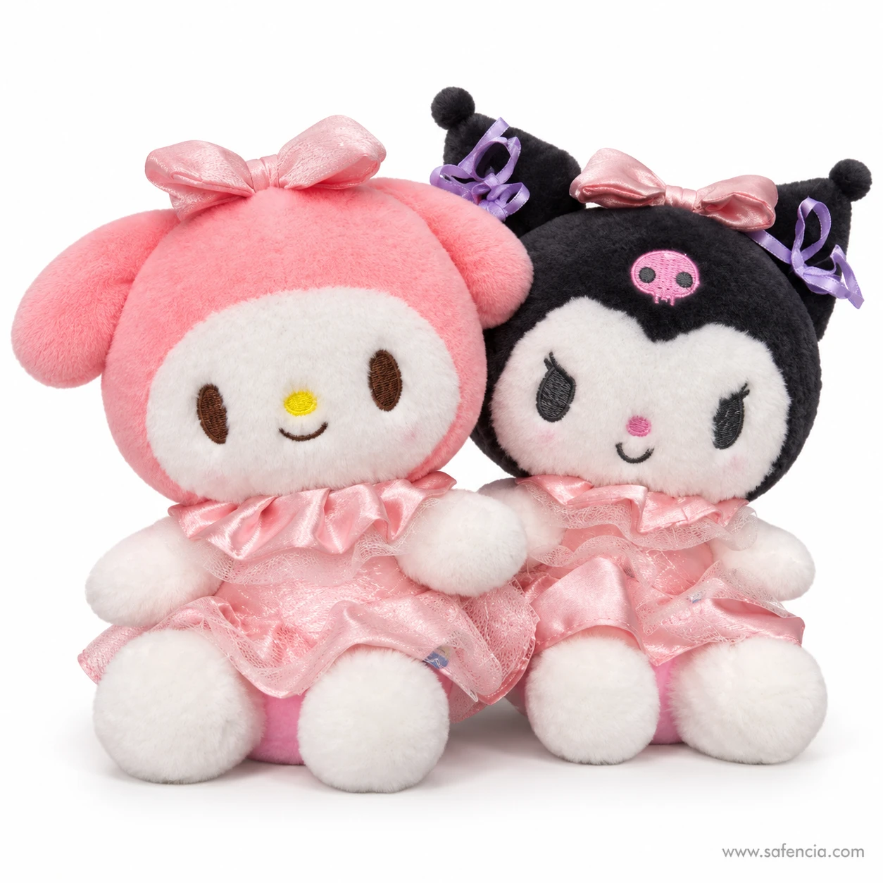 Close view of My Melody and Kuromi plush faces side by side, pink hood beside black hood