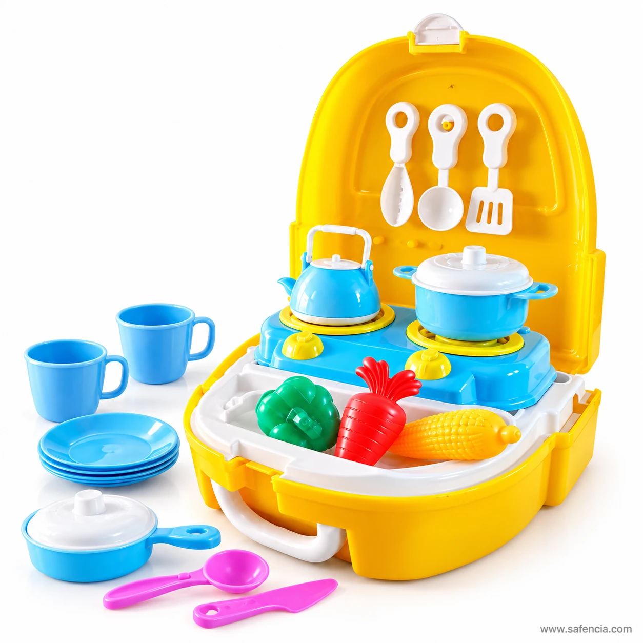 Little Chef kitchen accessories laid out: two blue cups, a stack of plates, a frying pan, pink spoon and pink knife