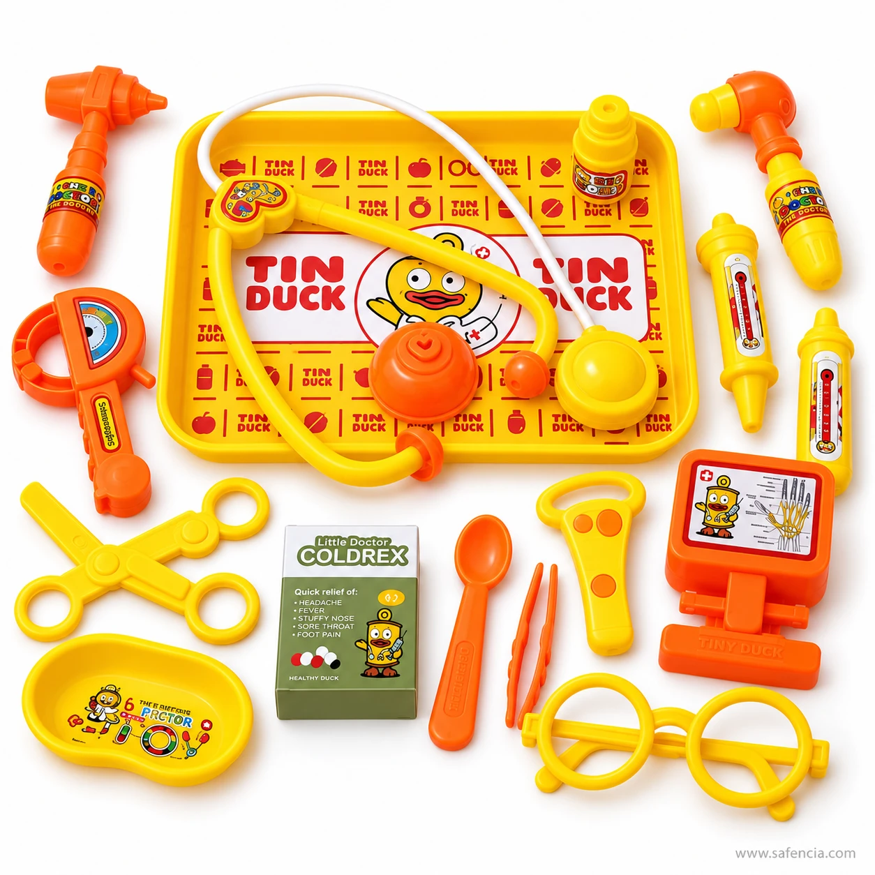 Yellow and orange kids doctor set tools arranged around the Tin Duck tray, with scissors, spoon, kidney dish and x-ray screen