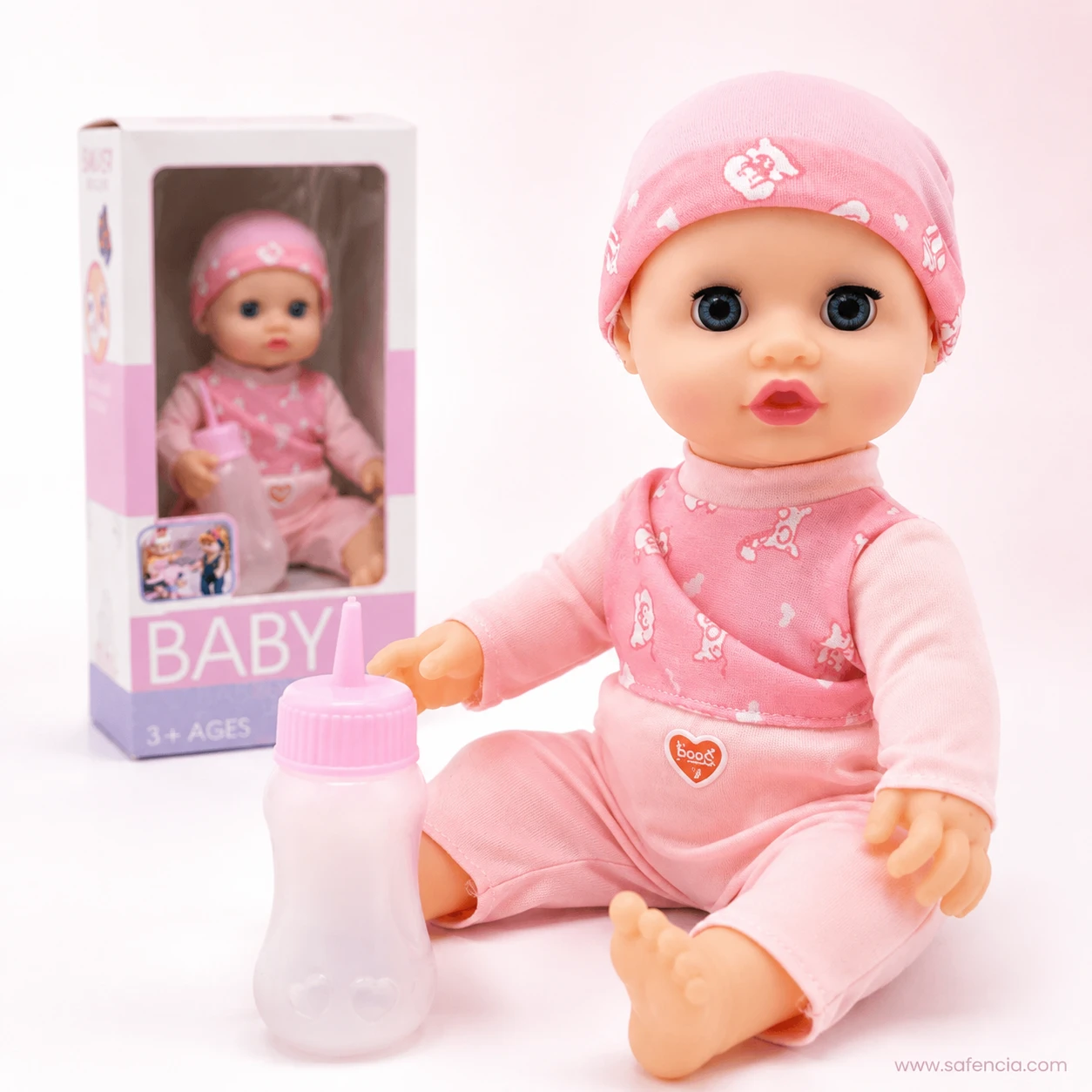 Pink bunny baby doll seated in front of her tall window carton marked 3 plus ages