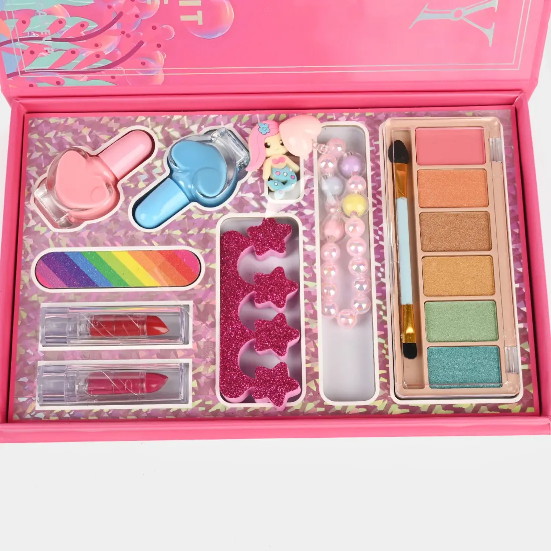 Mermaid Shell Makeup Kit open view - eyeshadows, heart blushes, lip glosses and nail file