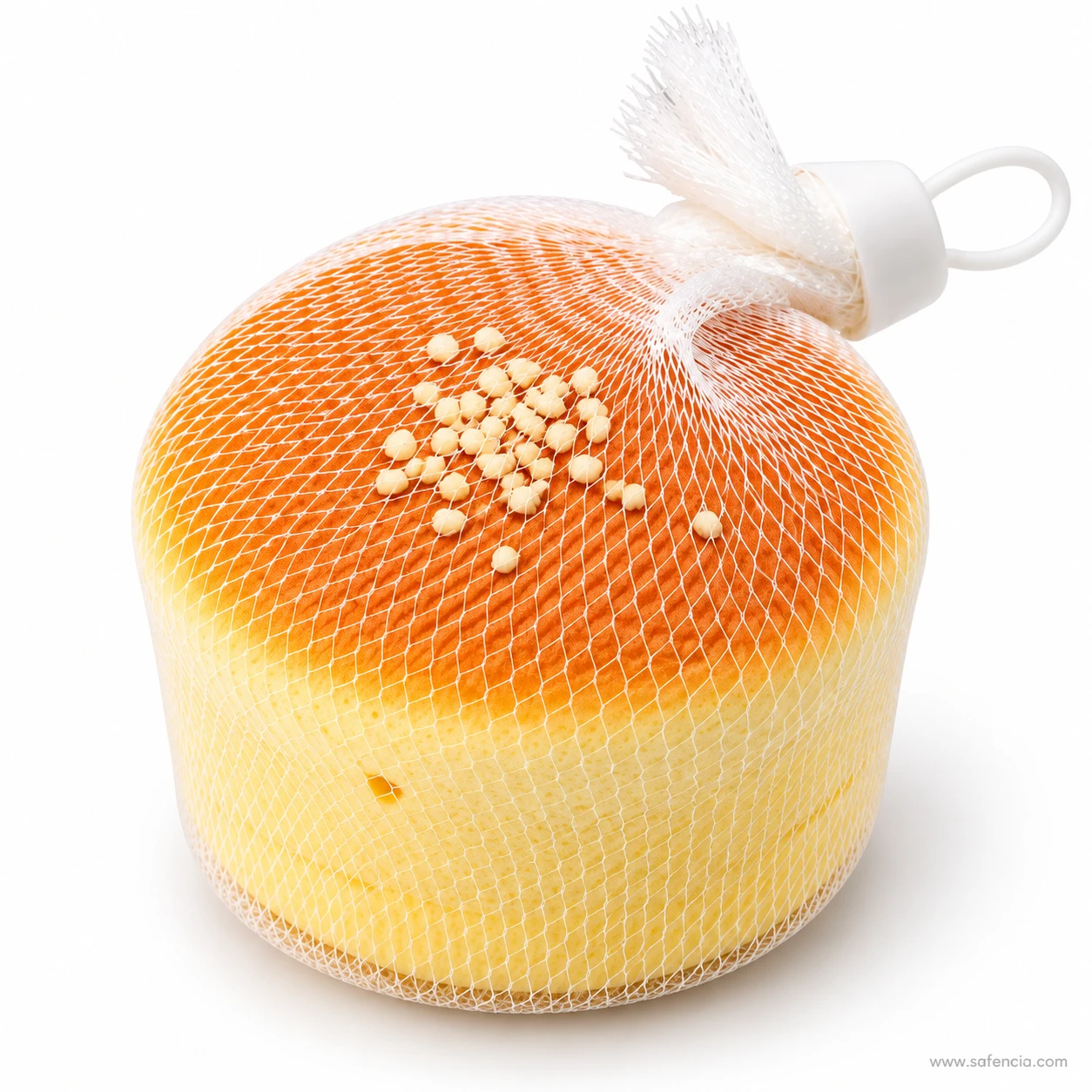 Close view of the crumb topping on the baked top of the mini sponge cake squishy through the net