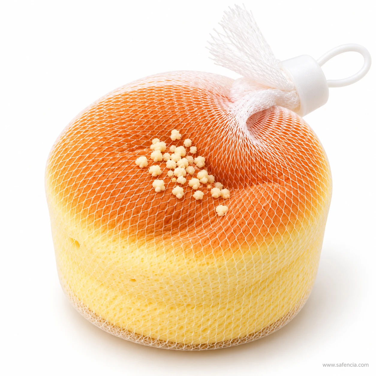 Soft dent in the baked top of the mini sponge cake squishy as it recovers its shape