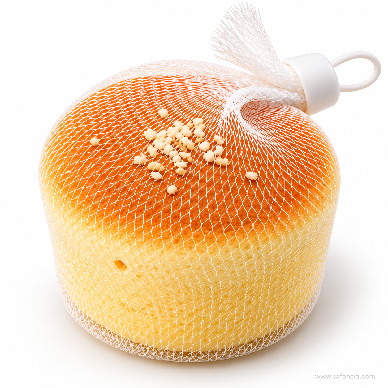 Mini sponge cake squishy standing upright with its net tied off in a tassel and plastic loop