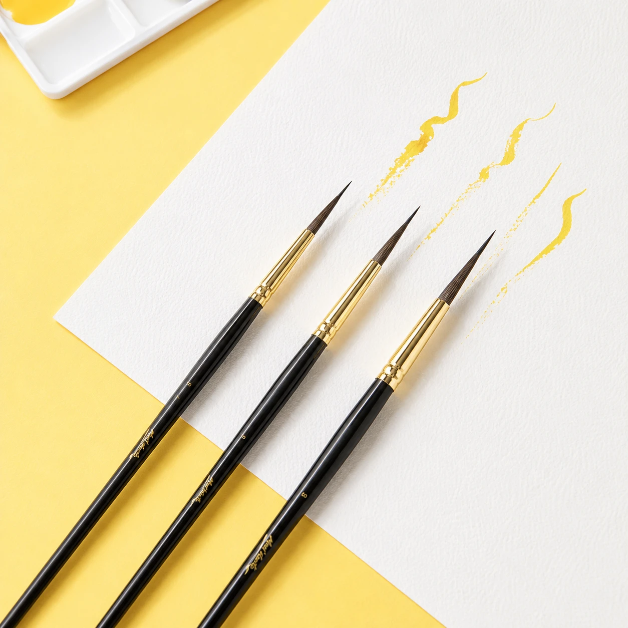 Three Mont Marte premium fat liner brushes showing natural wood short handles