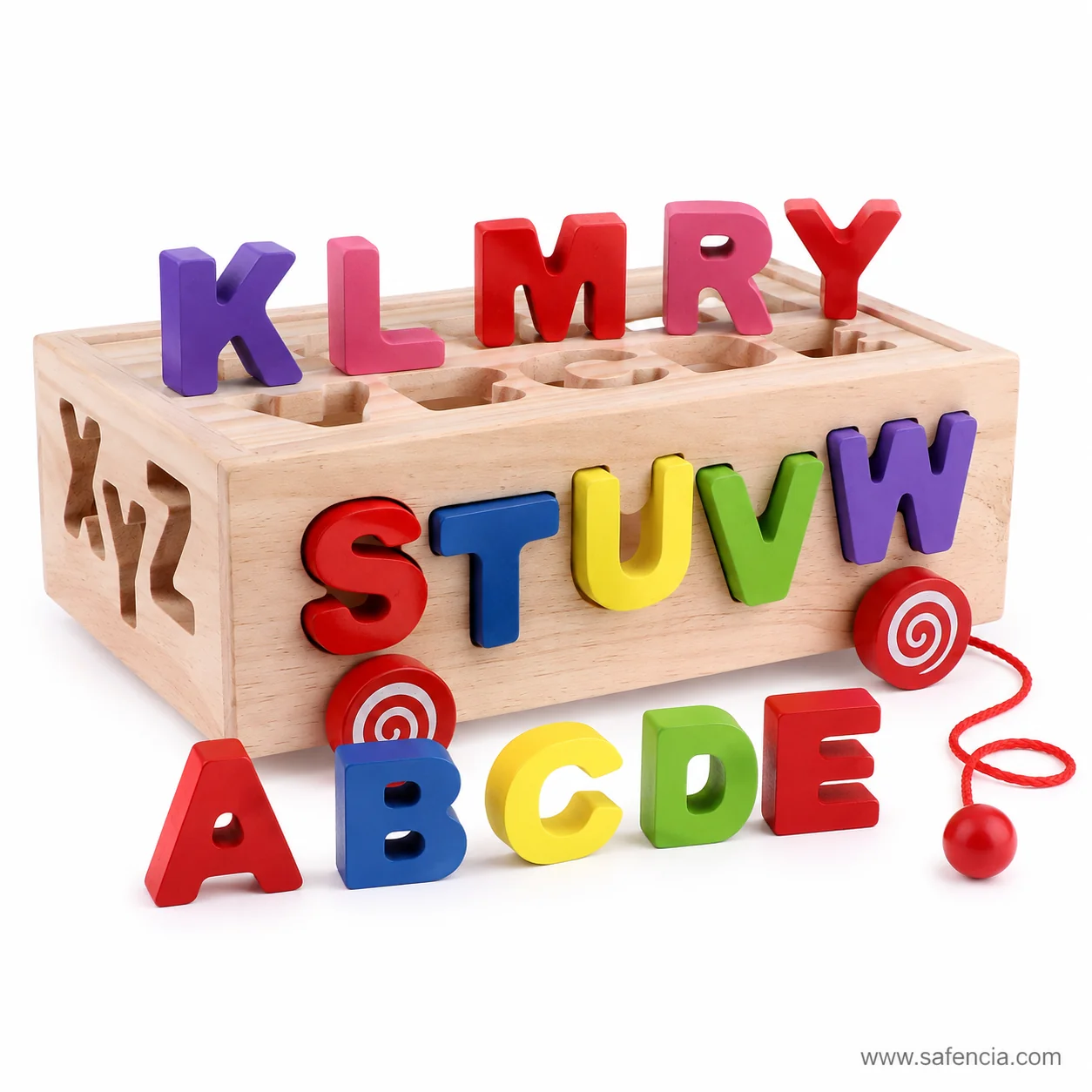 Coloured wooden capitals standing upright on the lid of the letter box