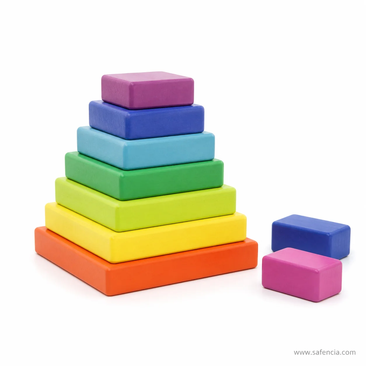 Part-built square block tower with two loose blocks waiting beside it