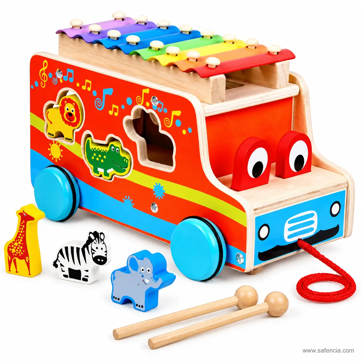 Wooden xylophone bus photographed with its two beaters and the red pull cord laid out