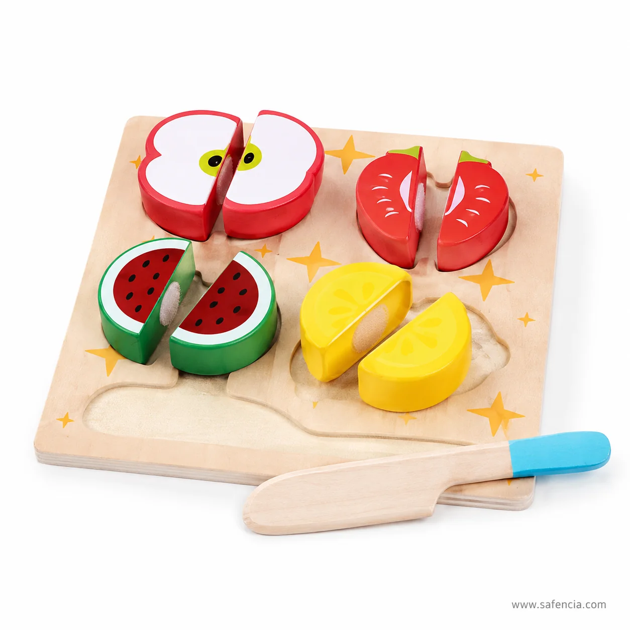 Wooden fruits split into halves on the cutting board showing the round fastening pads inside