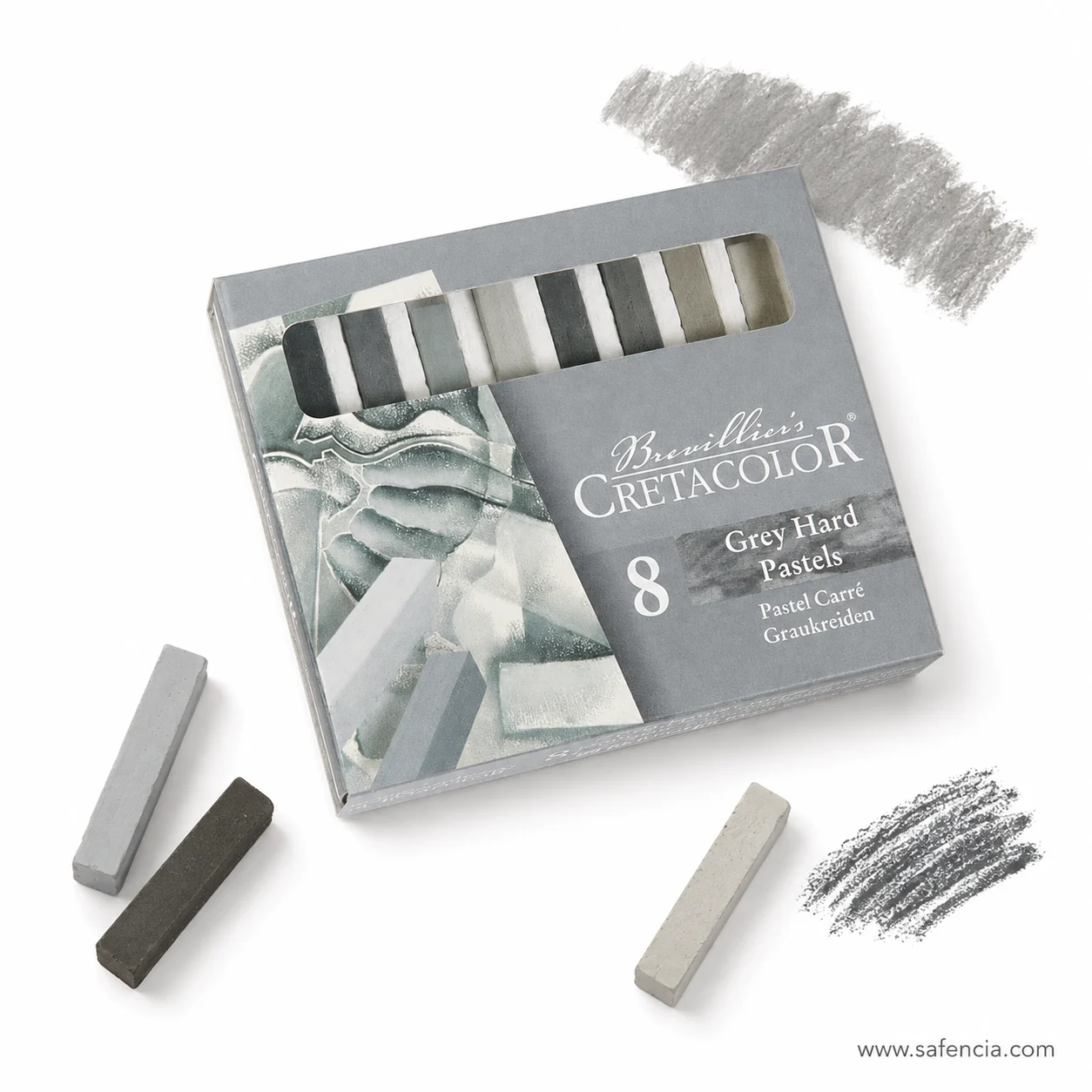 Grey hard pastel stroke swatched on white paper beside two loose sticks and the box