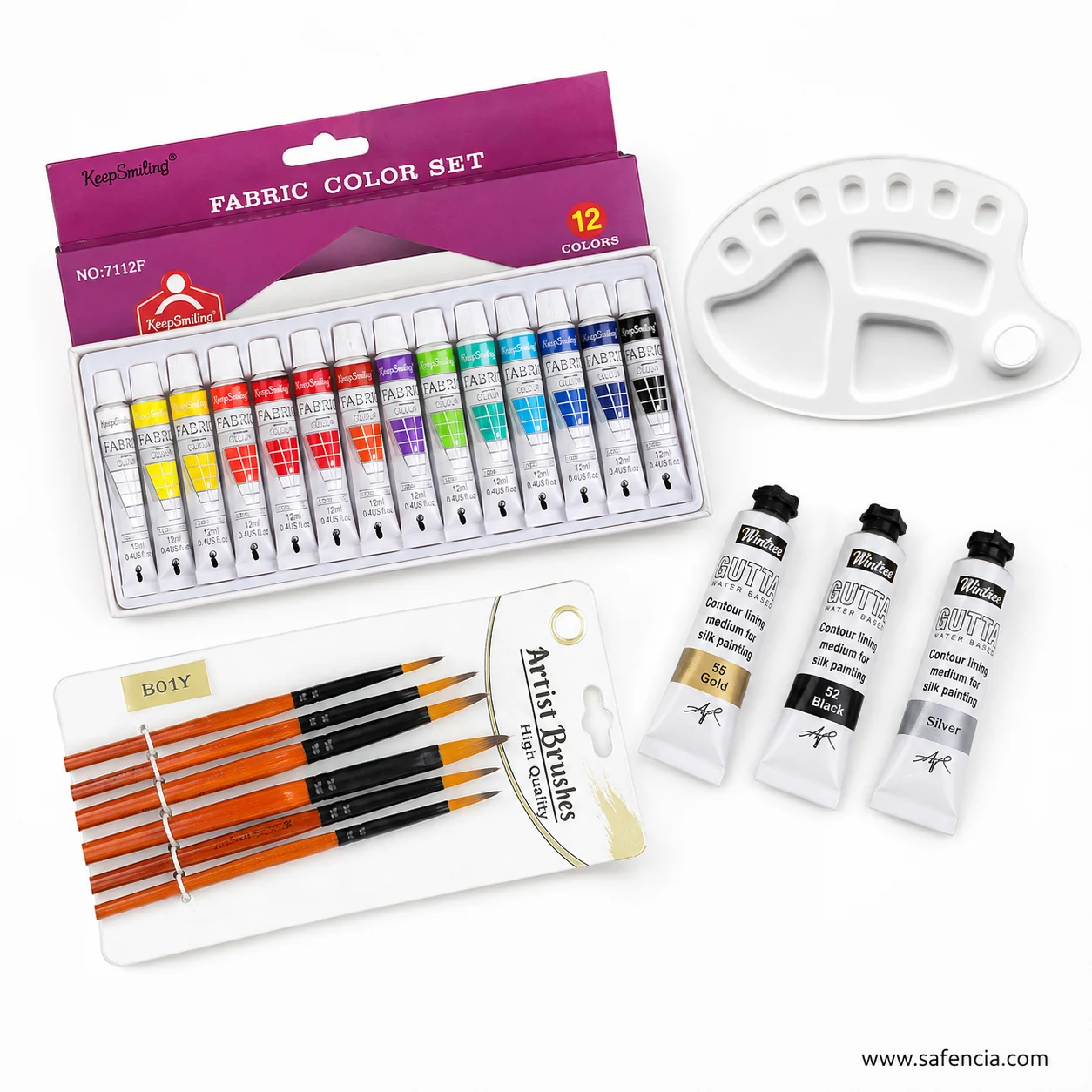 The Keep Smiling fabric colour carton and tray beside the gold, black and silver gutta liner tubes