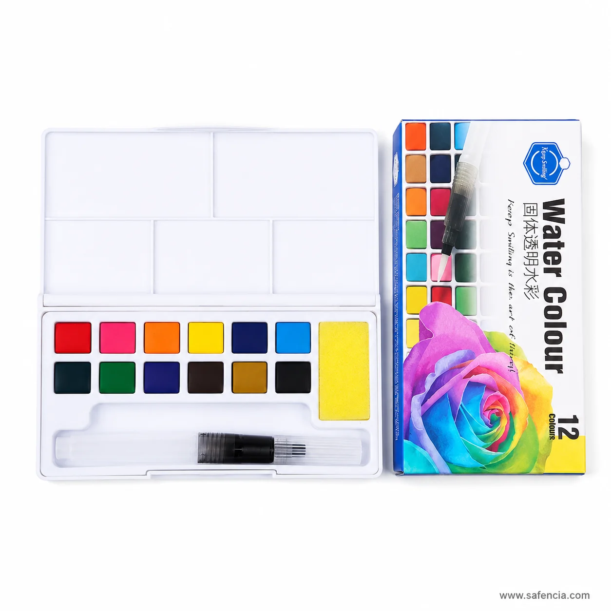 Keep Smiling Aquarelle palette photographed at an angle beside its blue-bordered carton