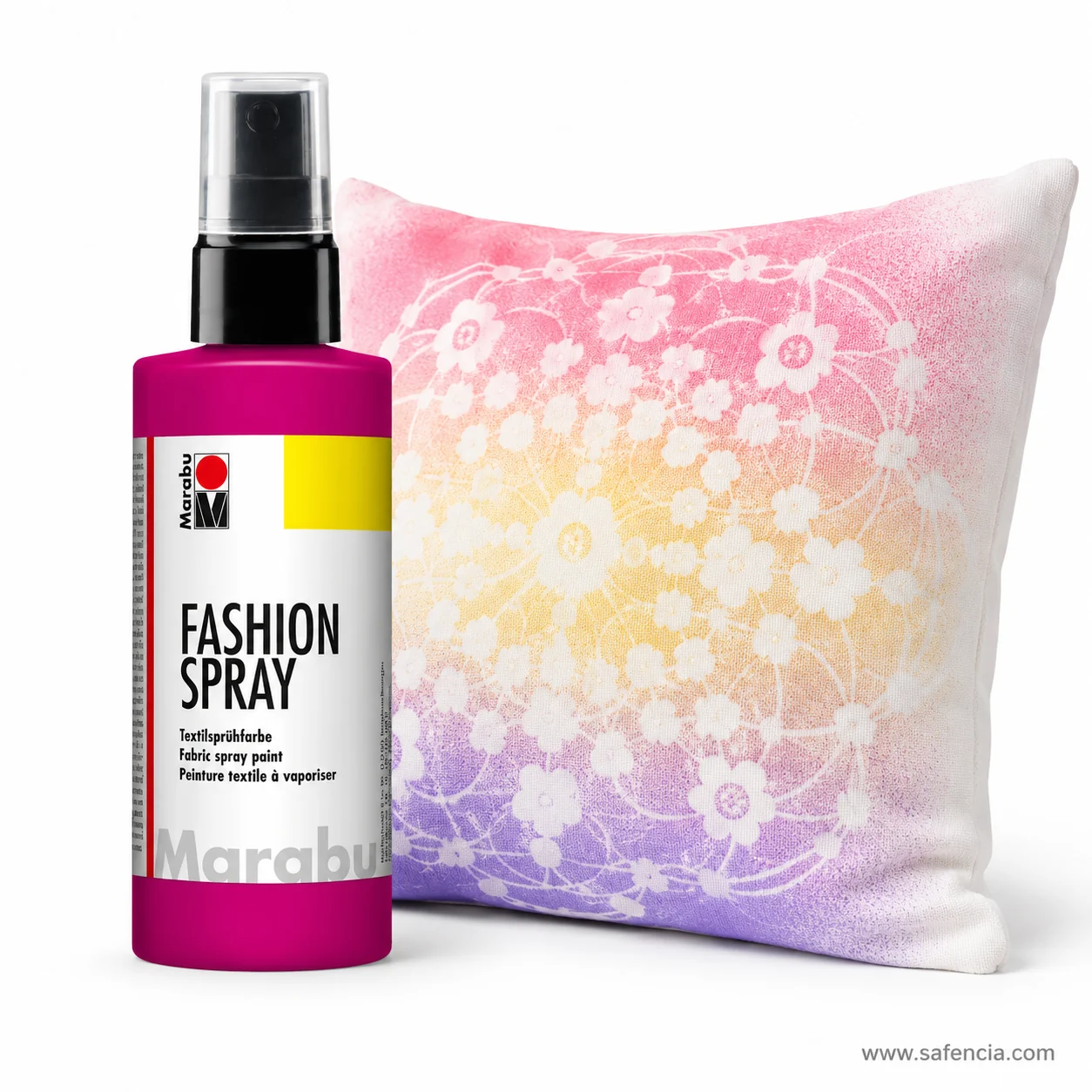 Marabu Fashion-Spray magenta bottle standing beside a cushion faded pink through peach to lavender