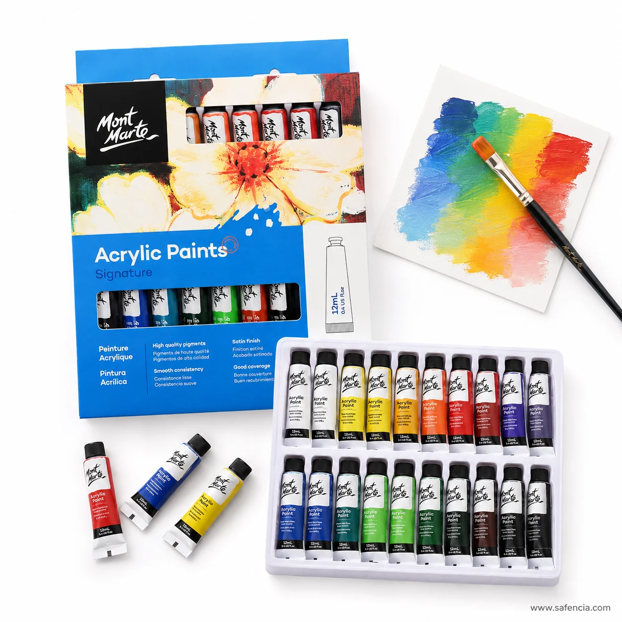 Mont Marte Signature acrylic blue box and tray beside a brush and a fanned rainbow swatch