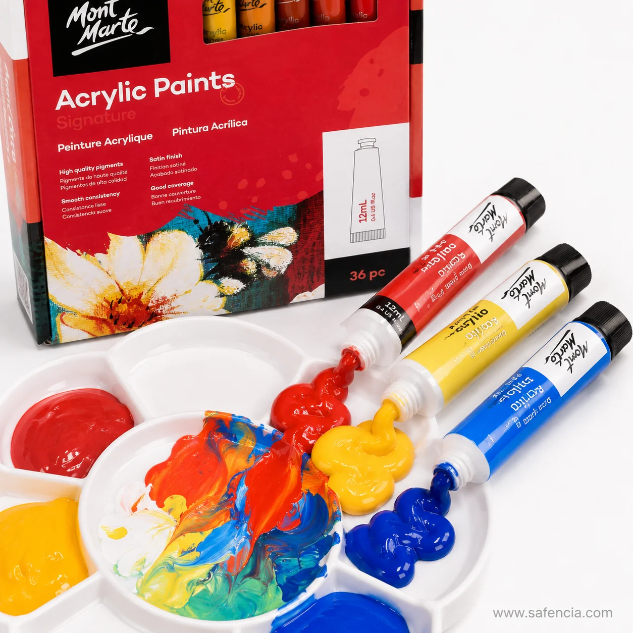 Three Mont Marte Signature 12 ml tubes squeezed onto a white flower palette with red yellow and blue paint