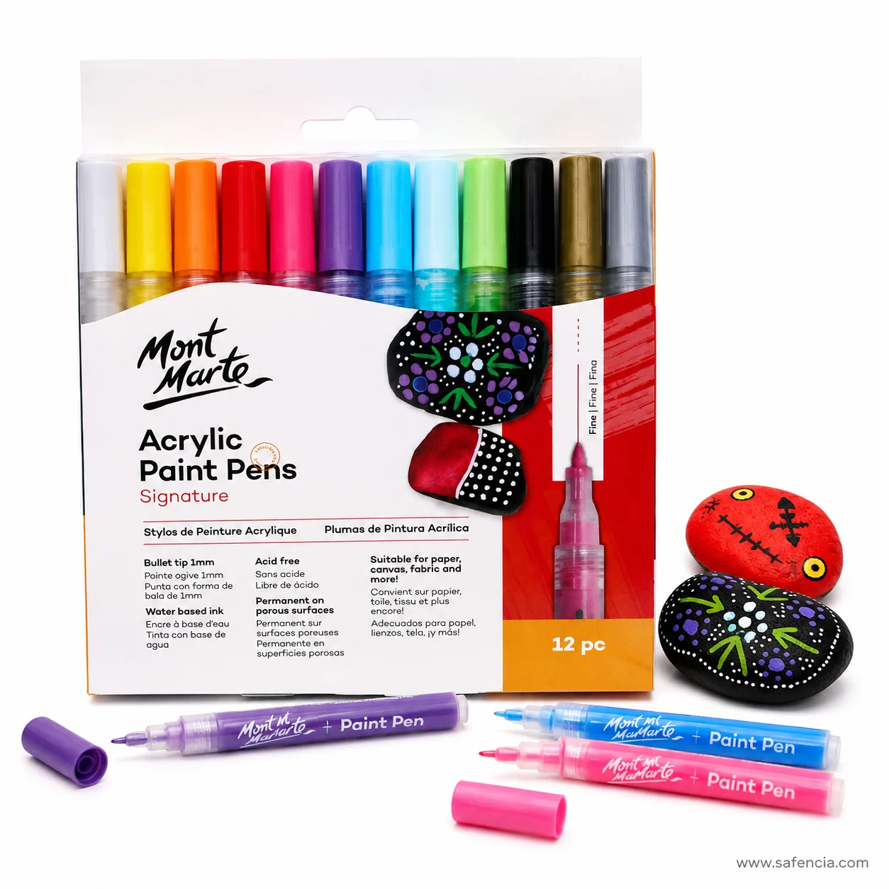 Mont Marte acrylic paint pens beside two painted rocks decorated with fine white dots and line patterns