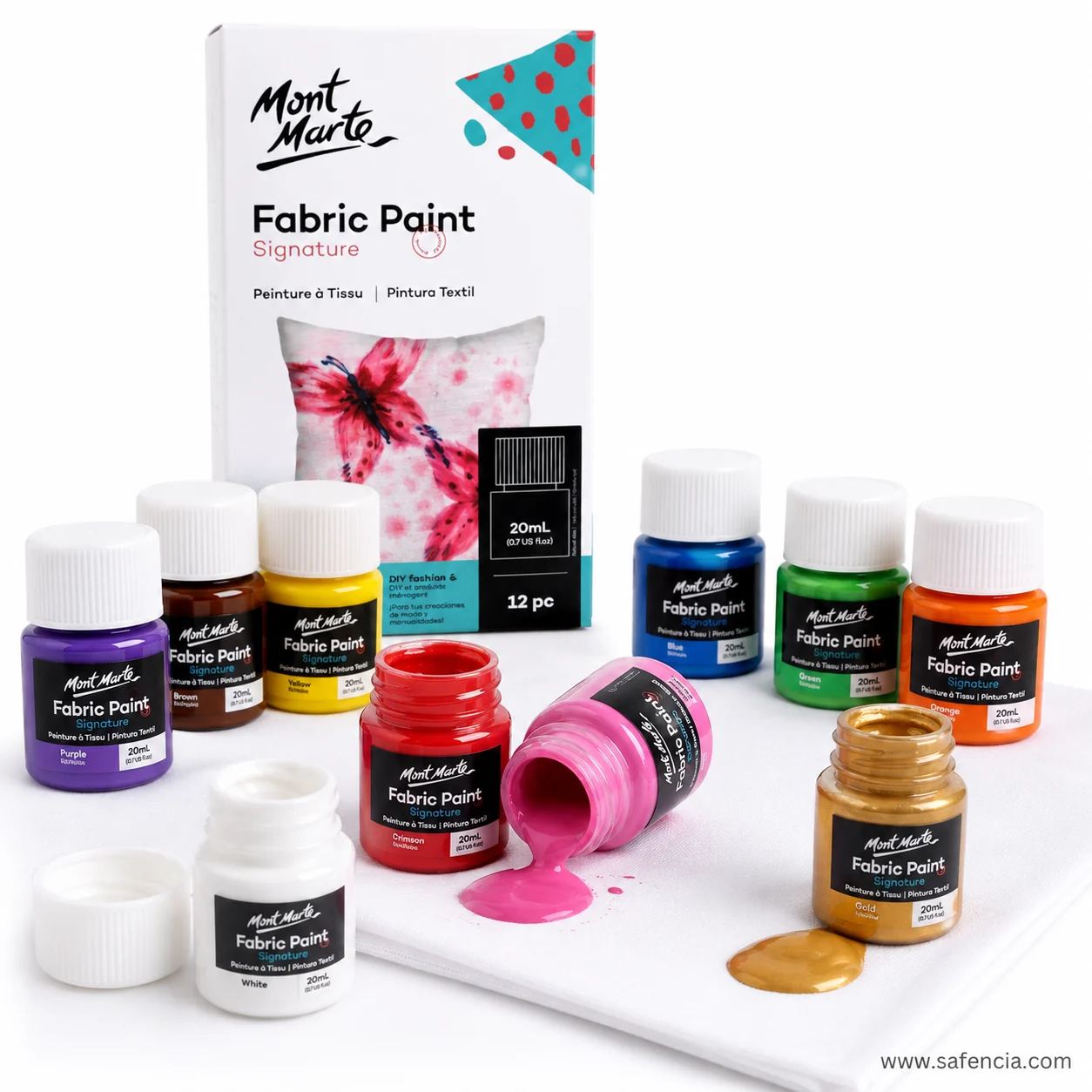 Mont Marte fabric paint bottles stacked beside a patterned cloth painted with leaves and flowers