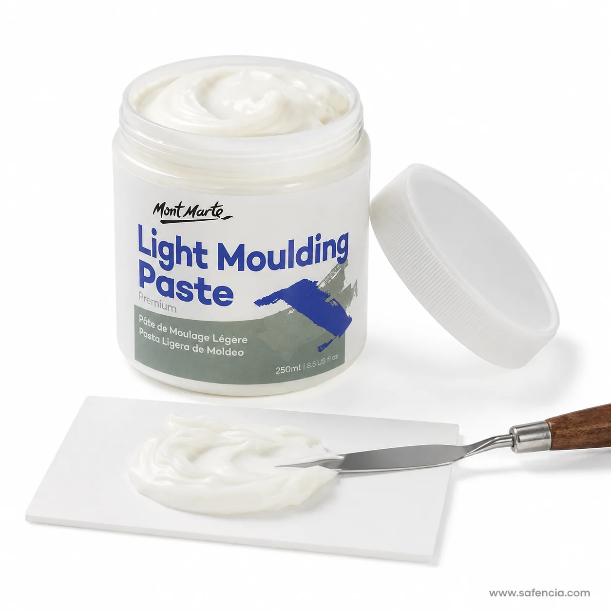 Open jar of light moulding paste with a palette knife spreading the paste on a white board