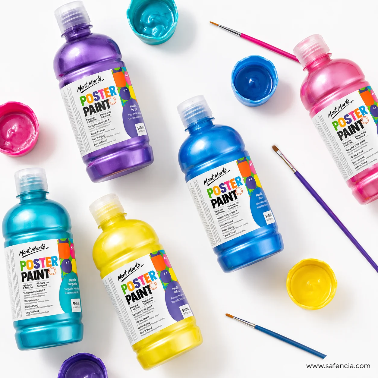 Metallic poster paint bottles arranged with open pots of colour and two paint brushes