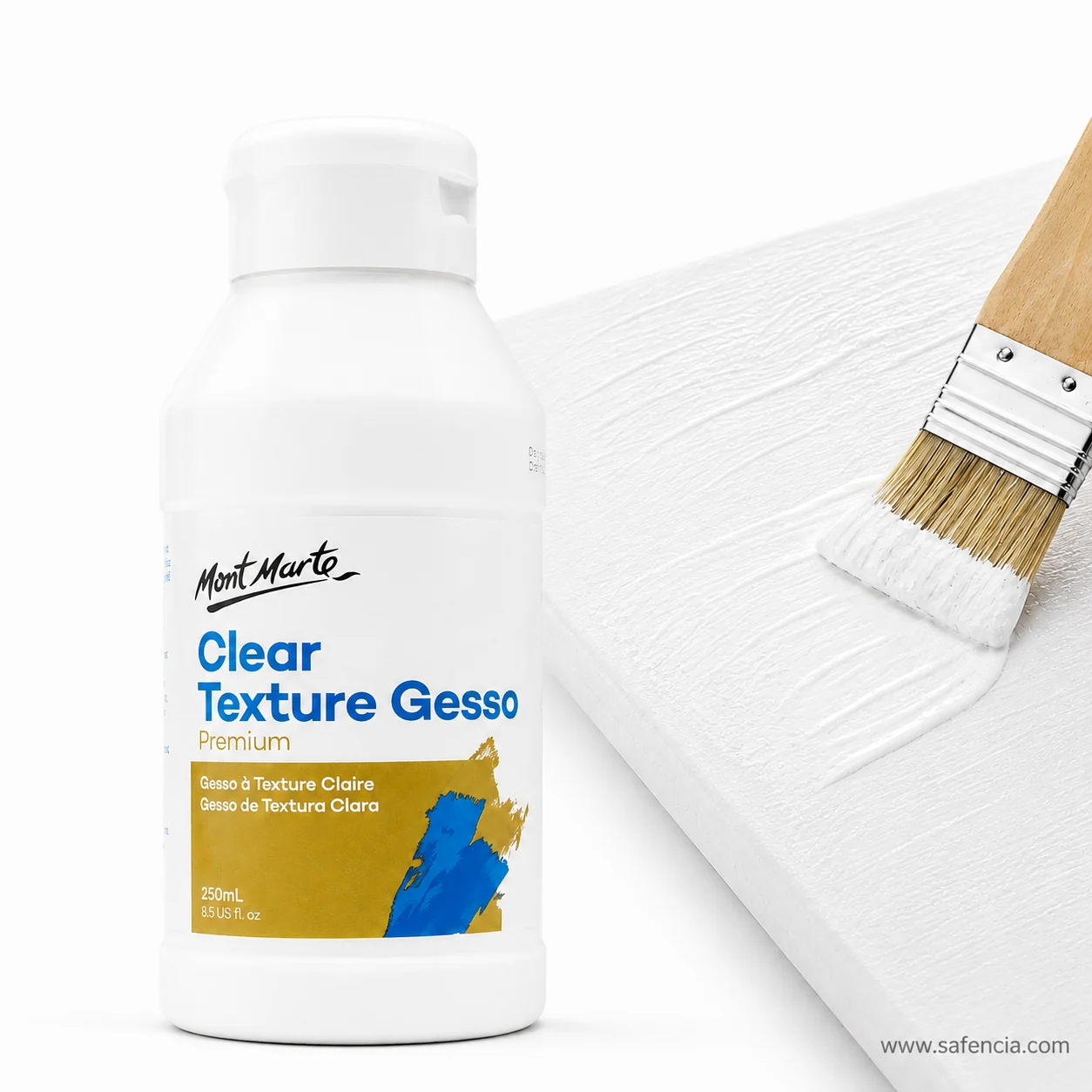 Clear texture gesso bottle standing beside a coated board and the brush used to apply it