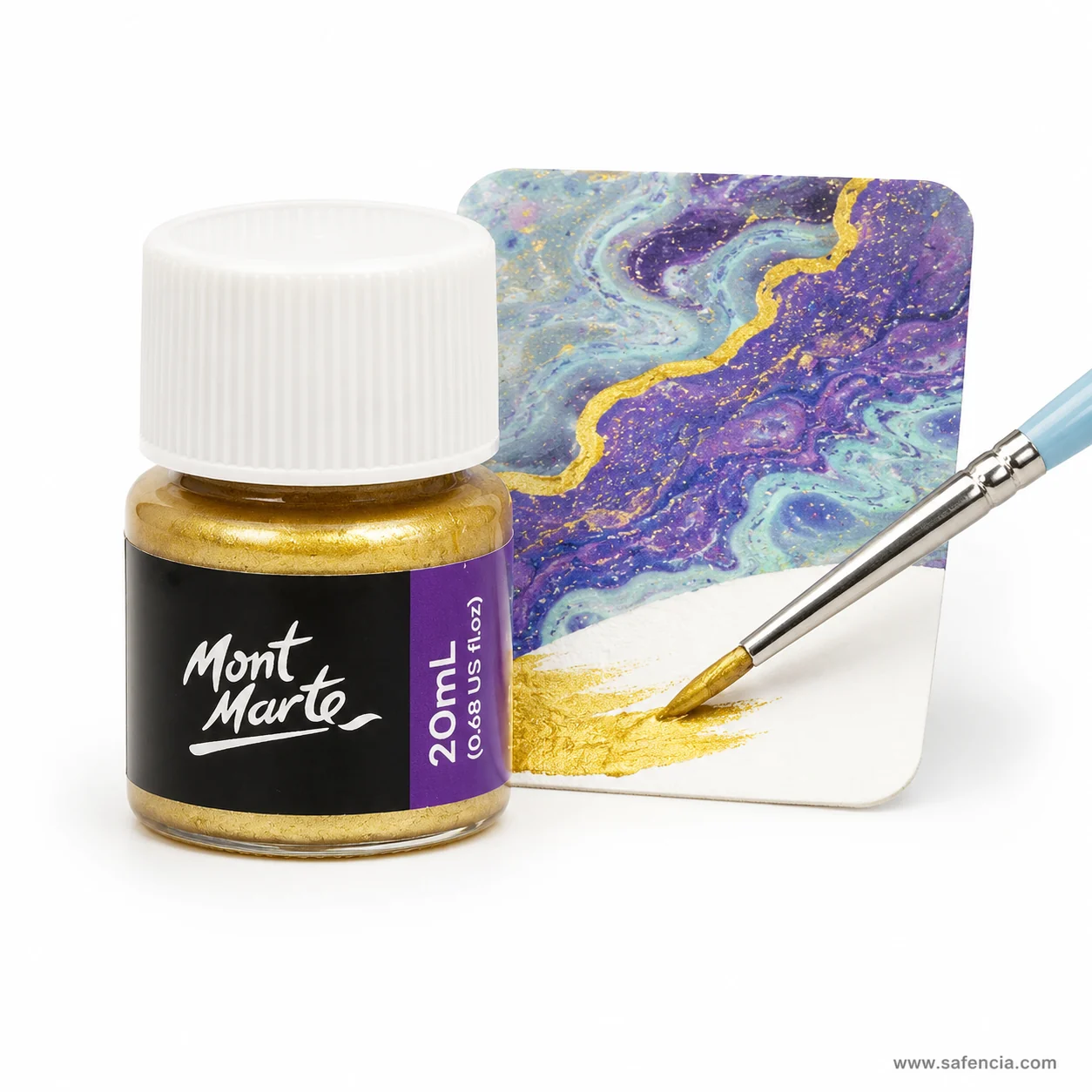 Gold foil paint being brushed as detail onto a dry purple and blue acrylic pour artwork