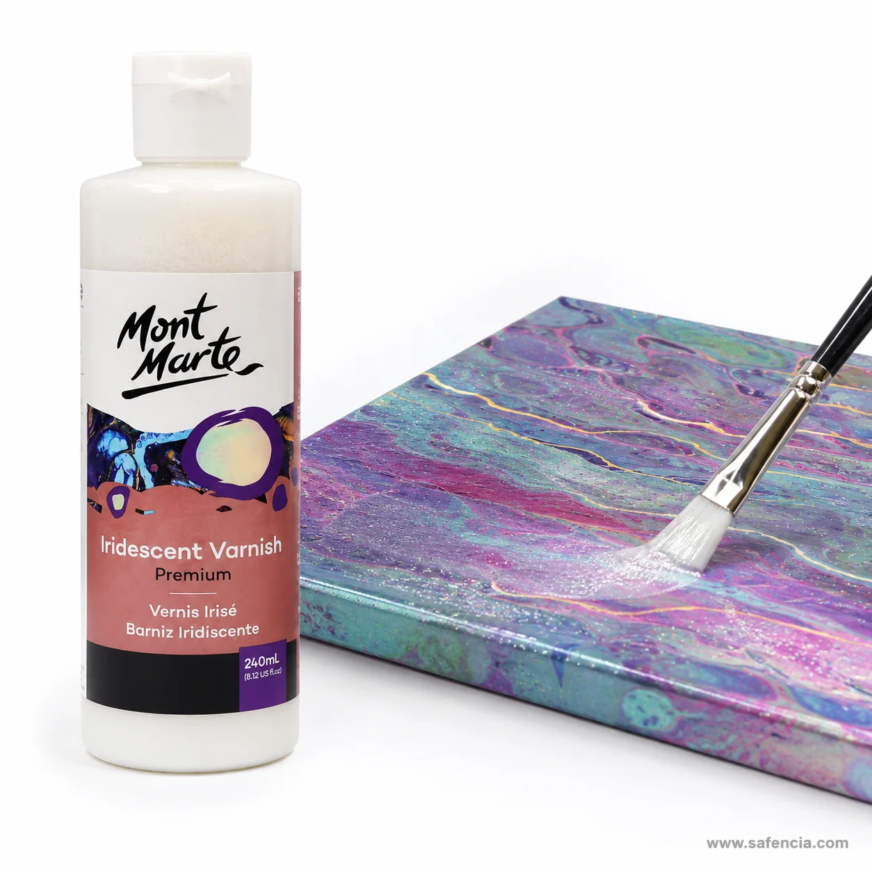 Brush laying iridescent varnish across a poured pink blue and green acrylic panel