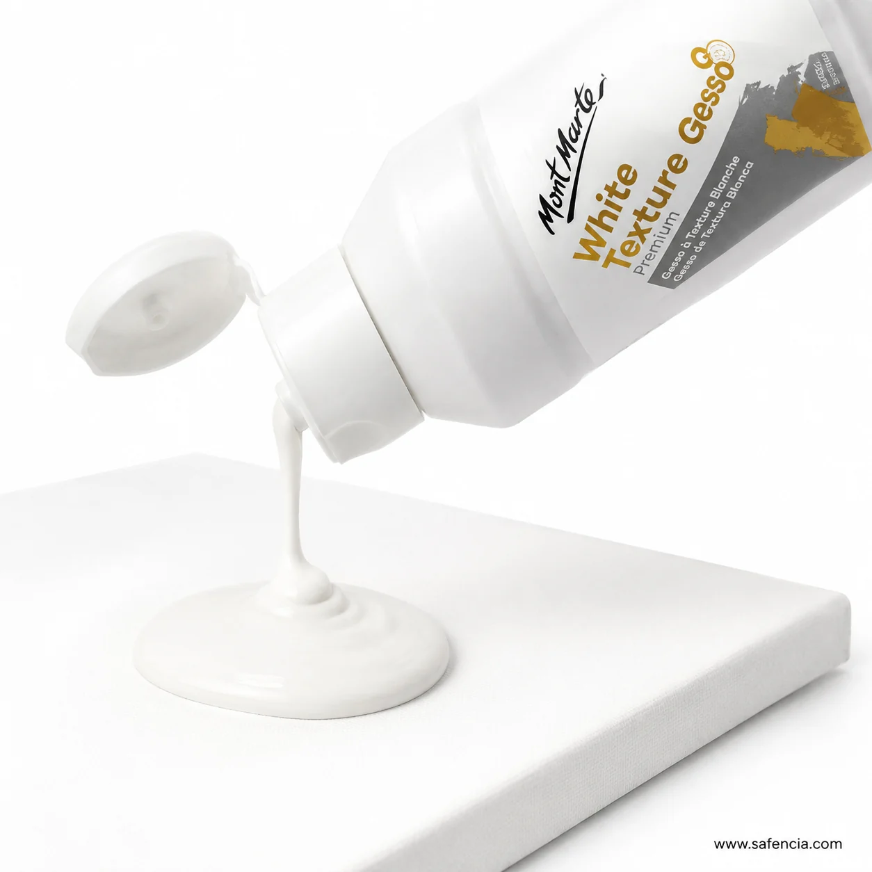 White texture gesso pouring from the tipped bottle as a thick creamy stream onto a white board