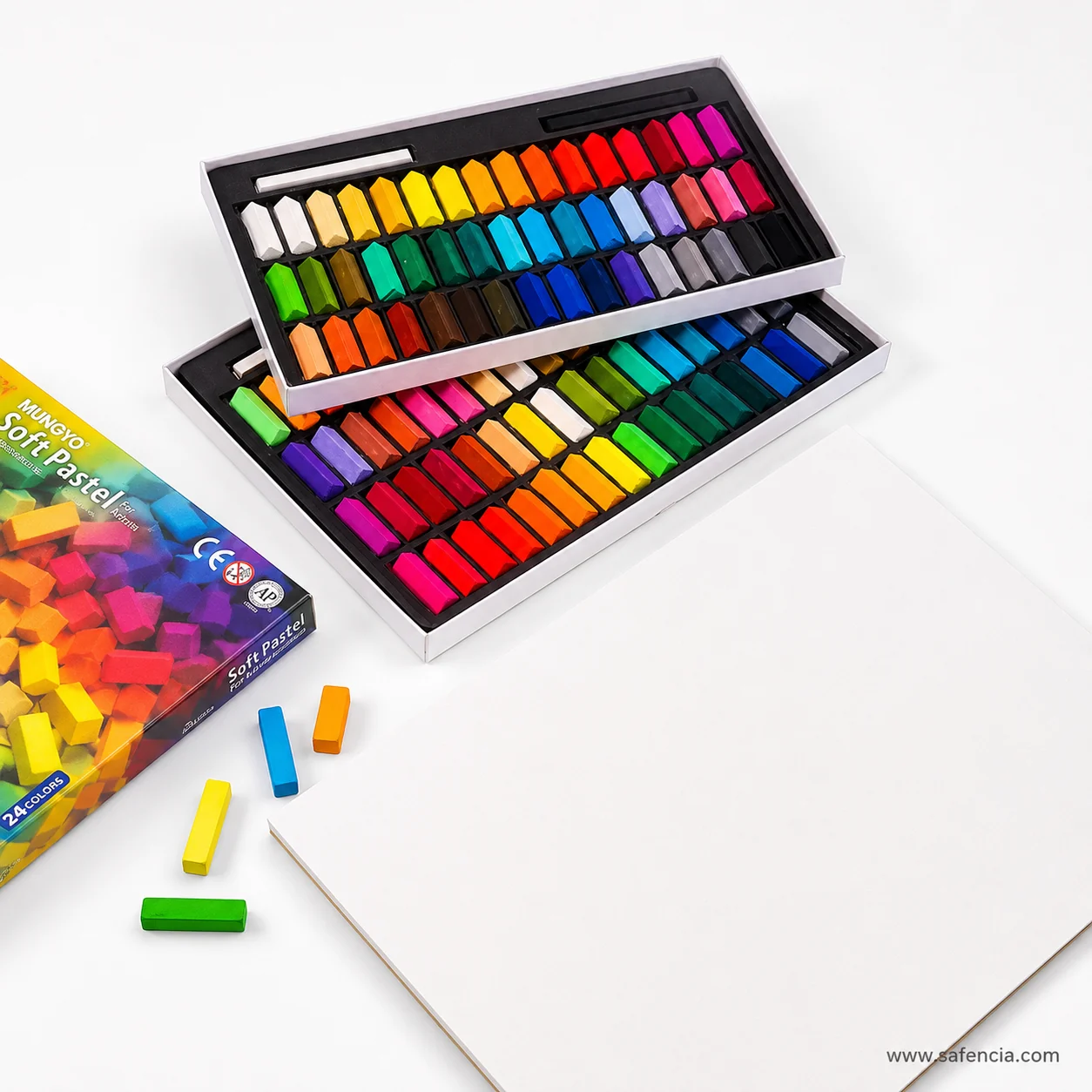 Two open trays of Mungyo half soft pastels showing the full spread of mini stick colours