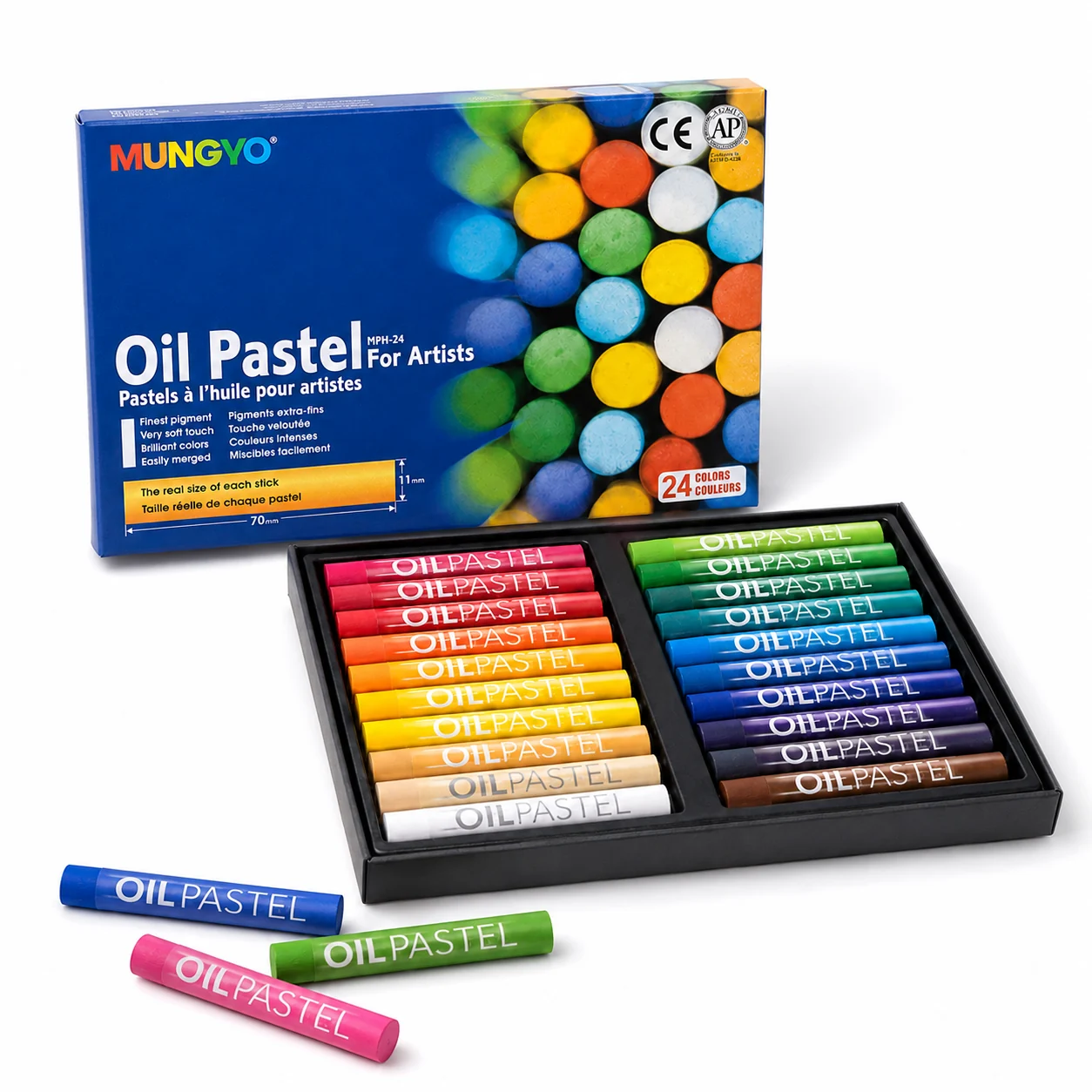 Mungyo oil pastel tray with three loose sticks laid in front showing the paper wraps