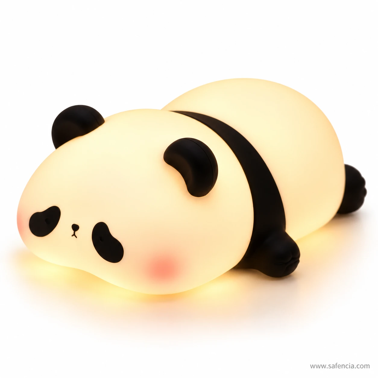 Side view of the panda lamp lit up, warm light spreading through the silicone body