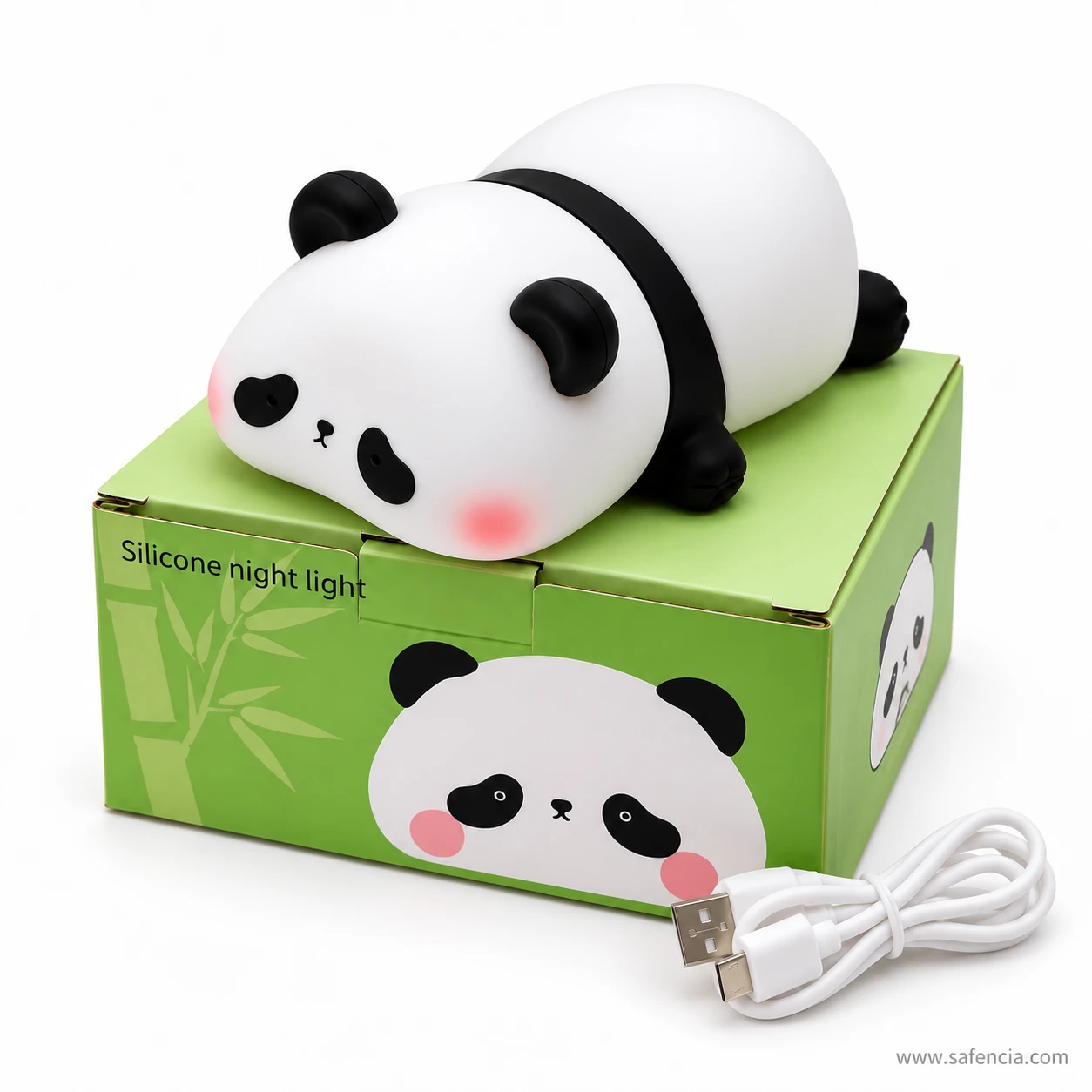Panda lamp resting on top of its green Silicone night light box with the cable beside it