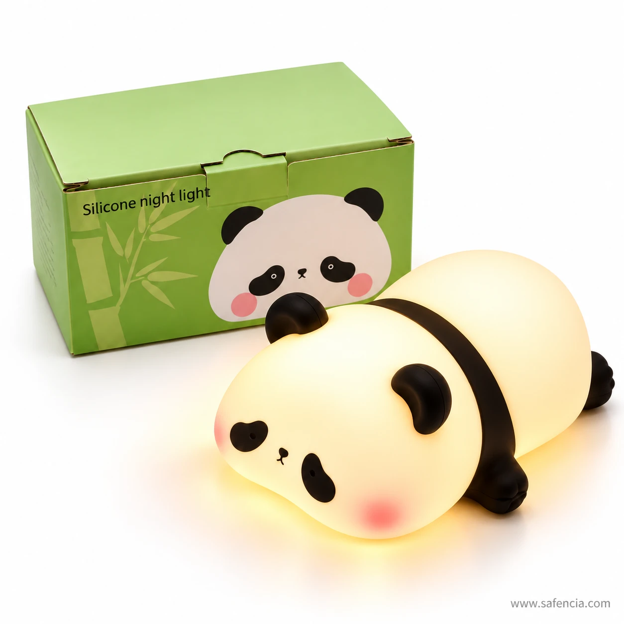 Panda night light glowing warm white in front of its green panda-print gift box