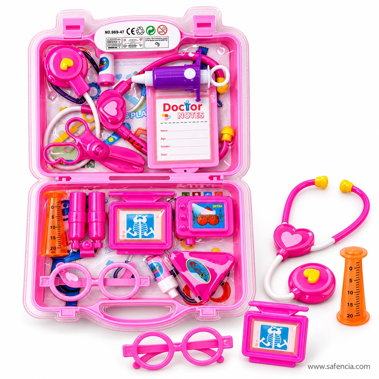 Pink doctor kit with the stethoscope, round glasses, x-ray viewer and orange measuring tube laid out in front of the case