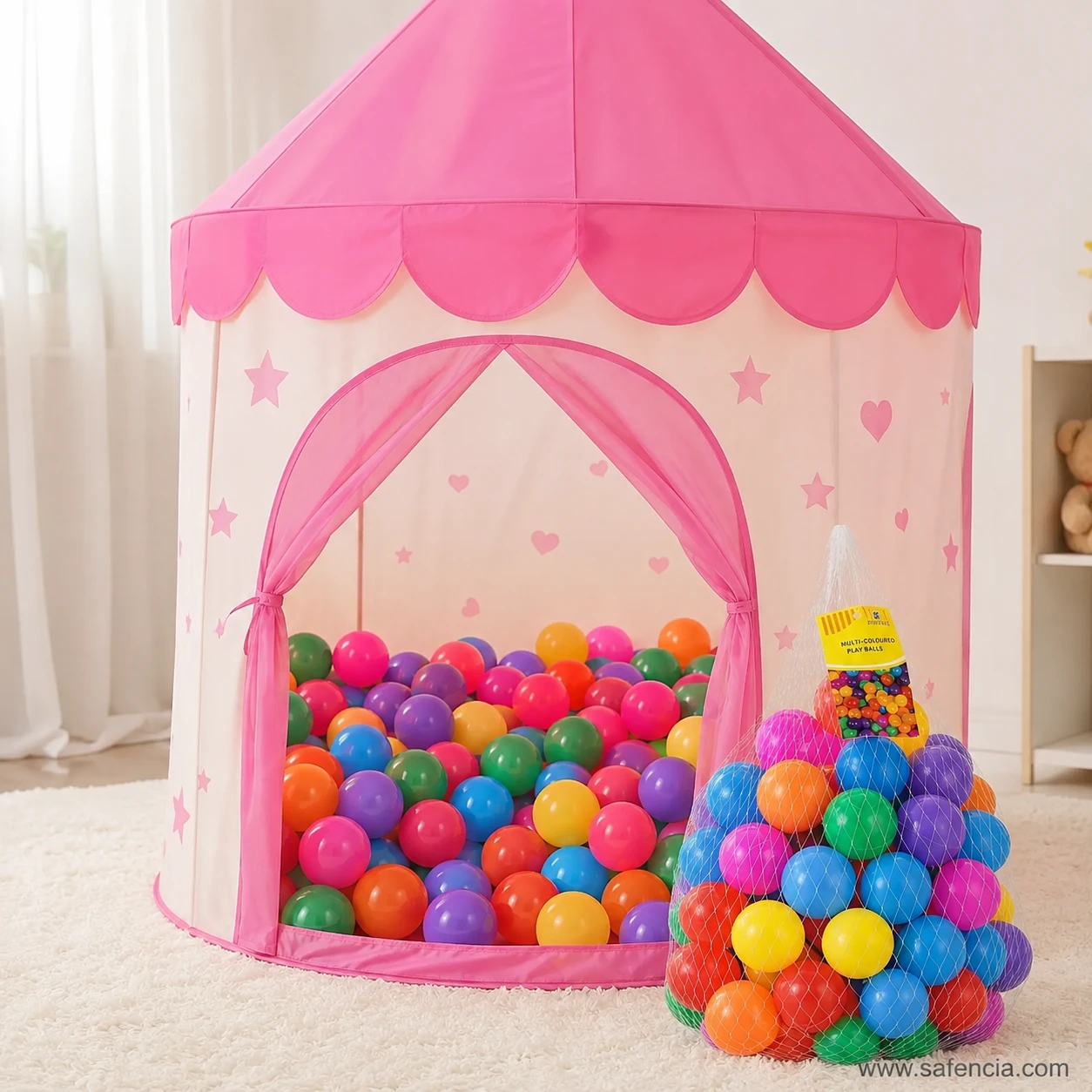 Kids pink princess castle play tent filled with multicolor soft plastic play balls for indoor fun